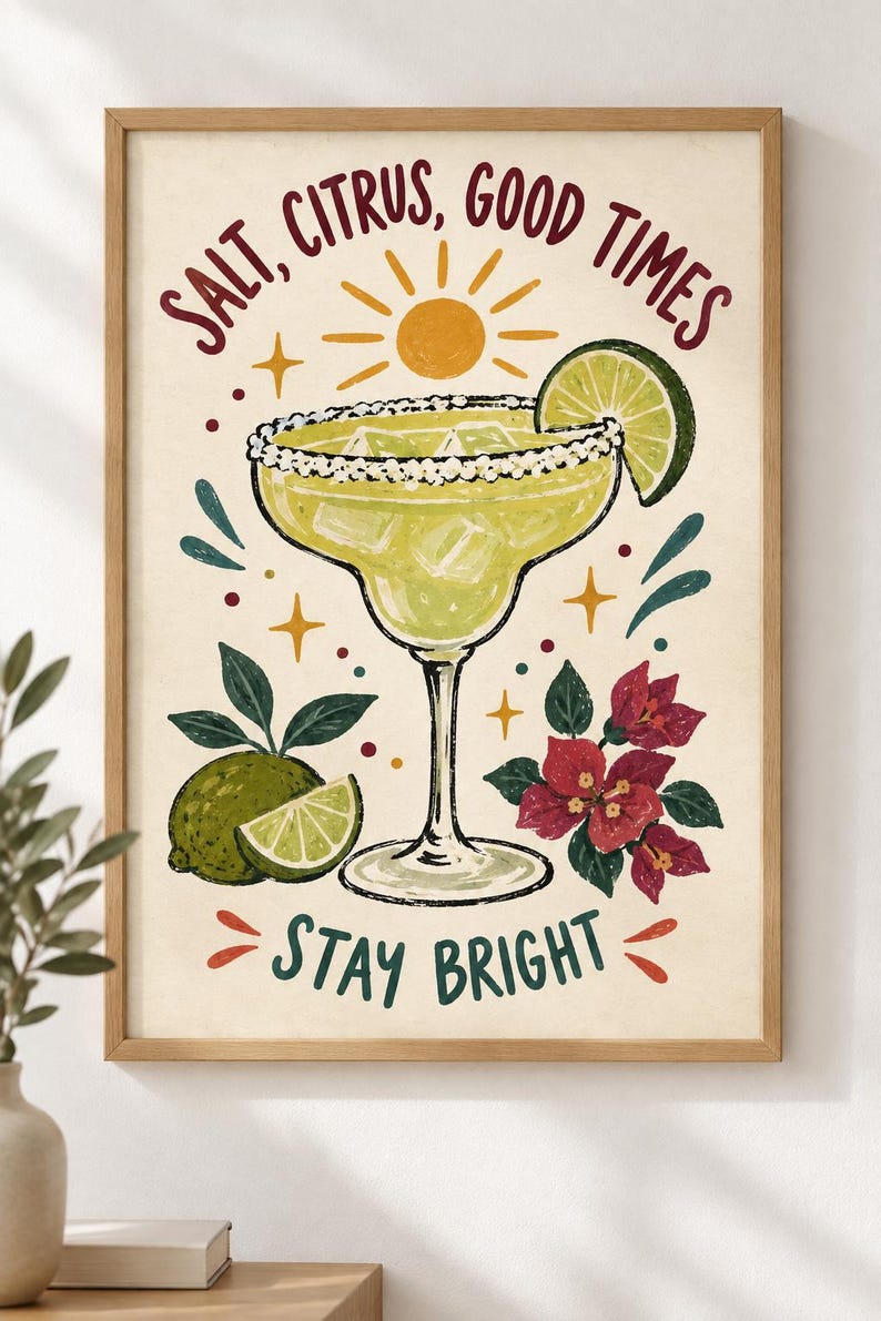 May include: A framed wall art print featuring a margarita in a glass with a salted rim, ice cubes, and a lime wedge. The text reads SALT, CITRUS, GOOD TIMES and STAY BRIGHT. The illustration includes a yellow sun, lime fruit, and red flowers.