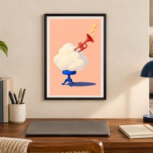 May include: A framed wall art print featuring a surreal illustration on a peach background. A fluffy white cloud sits atop a small blue stool, with a red trumpet emerging from the top, emitting three yellow circular notes into the air.