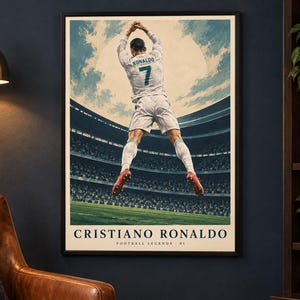 May include: A framed poster featuring a soccer player in a white jersey with the name RONALDO and number 7 on the back, jumping in a stadium. The text CRISTIANO RONALDO and FOOTBALL LEGENDS 01 is printed at the bottom of the illustration.