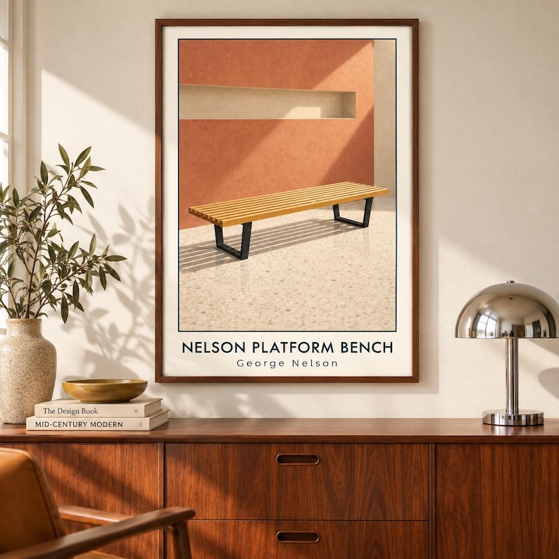 May include: A framed wall art print featuring a slatted wooden bench with black metal legs set against a terracotta wall. The text NELSON PLATFORM BENCH and George Nelson is printed in black at the bottom of the white-bordered rectangular poster.