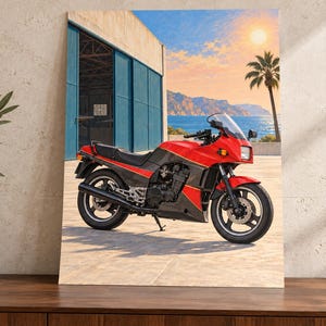 May include: A rectangular wall art print featuring a red and black sport motorcycle parked on a paved surface. The background displays a blue building, a palm tree, a calm sea, and a bright sun in the sky, creating a coastal outdoor scene.