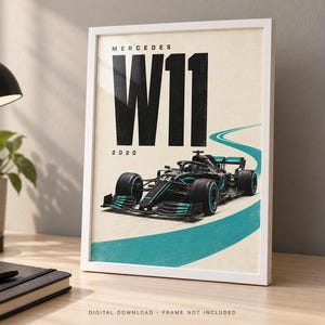May include: A framed poster featuring a black Mercedes W11 Formula 1 race car with teal accents on a cream background. The text reads MERCEDES W11 2020 in bold black letters. A teal curved line represents a track, and the car displays the number 44.