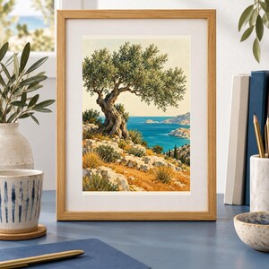 May include: A framed vertical art print featuring a gnarled olive tree perched on a rocky, sun-drenched hillside overlooking a deep blue sea. The landscape includes golden-brown grasses, light-coloured stone cliffs, and a distant coastal horizon.