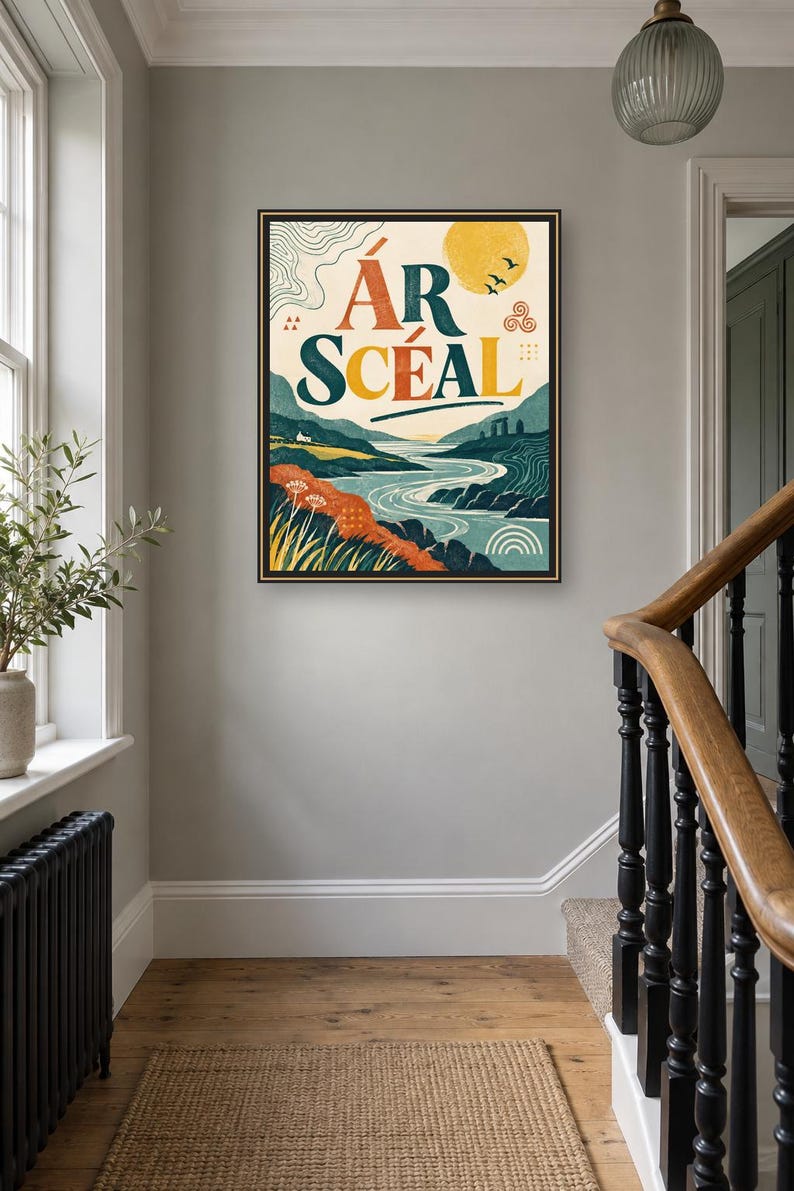 May include: A framed rectangular wall art print featuring a landscape illustration with a river, rolling hills, and a yellow sun. The text &Aacute;R SC&Eacute;AL is printed in large, bold letters at the top. The color palette includes shades of blue, green, orange, and yellow.