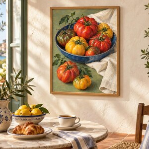 May include: A framed wall art print depicting a blue bowl filled with various heirloom tomatoes in shades of red, yellow, and green, with two additional tomatoes resting on a green surface next to a white cloth draped under the bowl.