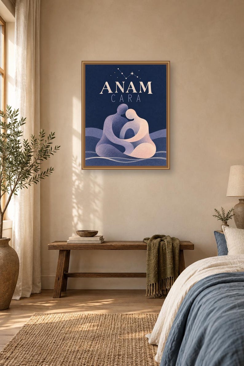 May include: A framed rectangular wall art print featuring a dark blue background with the text ANAM CARA in white capital letters. Below the text, two stylized figures in shades of purple and light pink are embracing, set against wavy lines.