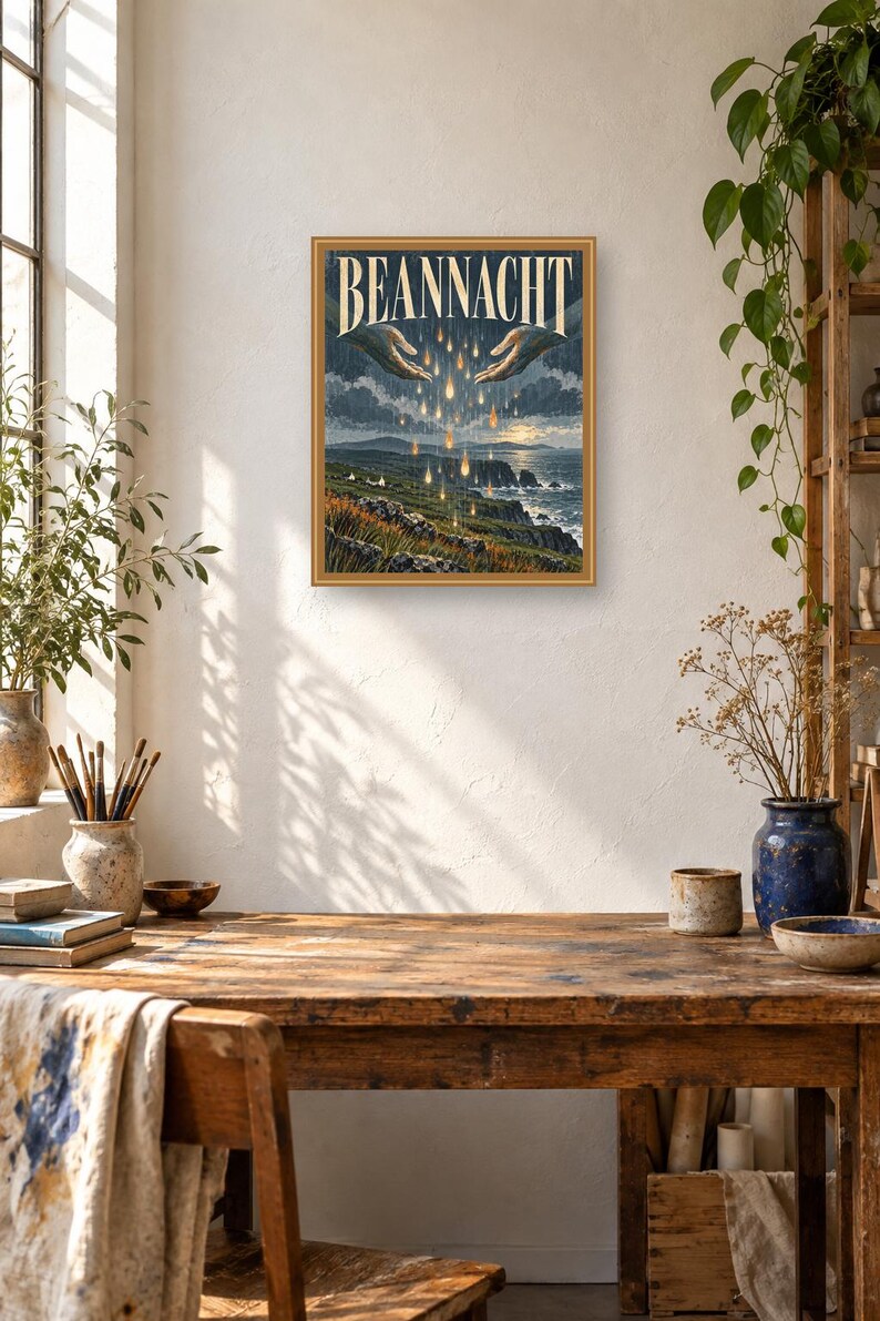 Puede incluir: Una impresi&oacute;n de arte mural rectangular enmarcada titulada BEANNACHT que presenta una ilustraci&oacute;n de dos manos extendidas una hacia la otra sobre un paisaje costero. Gotas doradas brillantes caen de las manos hacia un acantilado y el oc&eacute;ano.