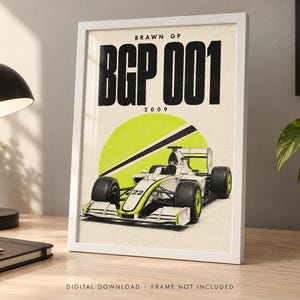 May include: A framed poster featuring a white and neon yellow Brawn GP BGP 001 Formula 1 race car with the number 22. The text BRAWN GP, BGP 001, and 2009 is printed in black at the top. The background is a cream color with a large neon yellow circle.