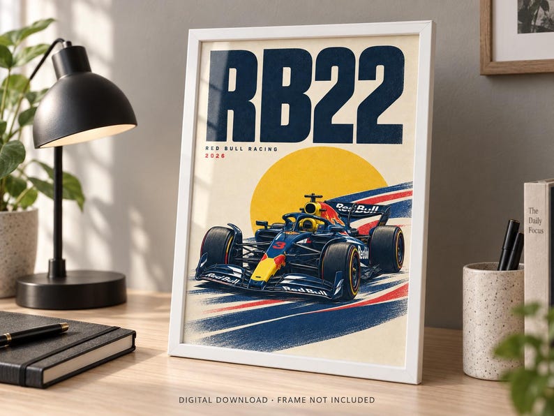 May include: A framed poster featuring a dark blue and yellow Red Bull Racing Formula 1 car with the number 3, set against a large yellow circle. The text RB22, Red Bull Racing, and 2026 are printed in dark blue and red on a cream background.
