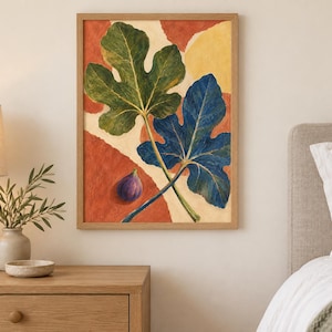 May include: A framed wall art print featuring a botanical illustration of two large fig leaves, one green and one blue, alongside a single purple fig. The background consists of abstract, rounded shapes in shades of terracotta orange and cream.