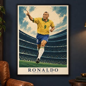 May include: A framed poster featuring a soccer player in a yellow jersey with the number 9 and blue shorts, celebrating on a field in a stadium. The text at the bottom reads RONALDO FOOTBALL LEGENDS - 02, set against a blue sky and clouds.