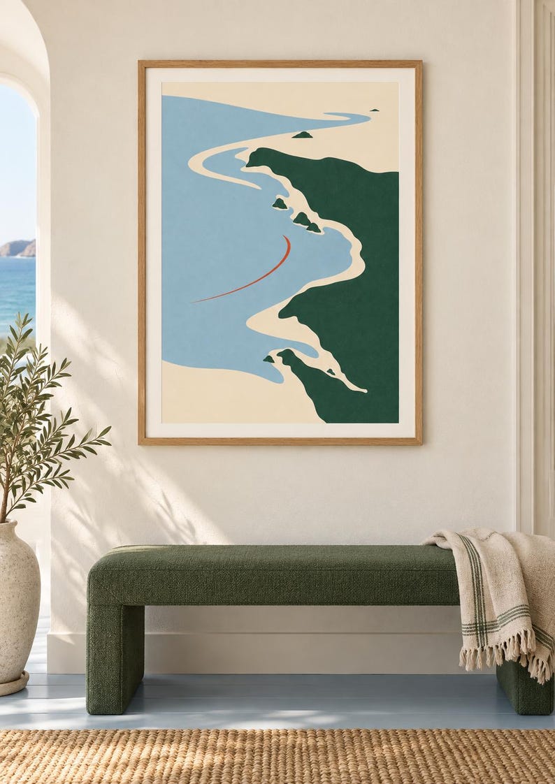 May include: A framed wall art print featuring a stylized coastal landscape with a light blue ocean, beige sandy shoreline, and dark green landmasses. A thin, curved red line is positioned in the water. The print is encased in a light wood frame.