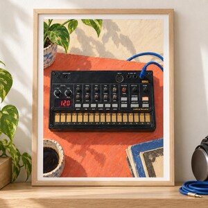 Puede incluir: Una caja de ritmos anal&oacute;gica Korg Volca Beats de color negro con teclado multit&aacute;ctil, varios mandos de control y una pantalla digital roja que muestra 120. El dispositivo est&aacute; enmarcado en madera clara, mostrando su interfaz con botones.
