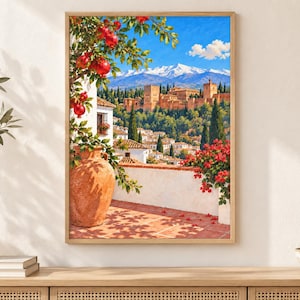 May include: A framed wall art print depicting a Mediterranean terrace with a large terracotta vase, a pomegranate tree with red fruit, and vibrant red flowers. The background features a historic stone fortress and snow-capped mountain peaks.
