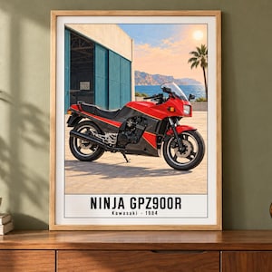 May include: A framed poster featuring a red and black Kawasaki Ninja GPZ900R motorcycle parked in front of a blue industrial building near the ocean. The text at the bottom reads NINJA GPZ900R Kawasaki 1984 in a clean, bold, black font.