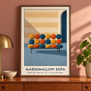 May include: A framed art print featuring the Marshmallow Sofa by George Nelson and Irving Harper. The illustration depicts a sofa with eighteen circular cushions in orange, yellow, and blue, set against a striped wall and a blue floor.