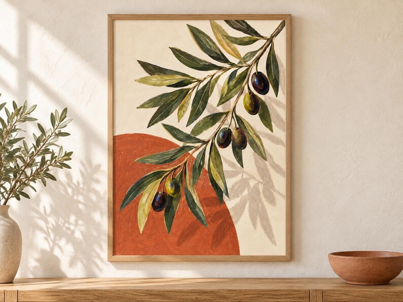 May include: A framed wall art print featuring an olive branch with green and dark purple olives against a cream background. A large, solid terracotta-colored semi-circle sits behind the branch, which casts a soft, detailed shadow on the canvas.