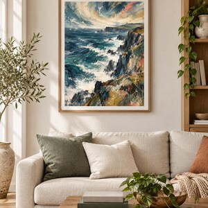 May include: A framed wall art print depicting a turbulent ocean scene with crashing waves against dark, jagged cliffs under a swirling, dramatic sky. The painting features deep blues, teals, and earthy tones of green, brown, and soft pink highlights.