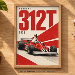 May include: A framed poster featuring a red Ferrari 312T Formula 1 race car from 1975. The artwork displays the text FERRARI 312T 1975 in bold red and black lettering against a white and red background. The car is numbered 12 on the side and front.