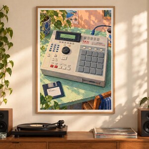 May include: A framed art print depicting an Akai MPC 2000XL MIDI production center on a light green table. The beige sampler features a black screen, a central dial, a grid of gray pads, and various buttons. A blue floppy disk sits nearby.