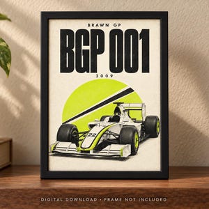 May include: A framed poster featuring a white and neon yellow Brawn GP BGP 001 Formula One race car with the number 22. The text BRAWN GP, BGP 001, and 2009 is printed in black against a cream background with a large neon yellow circle graphic.