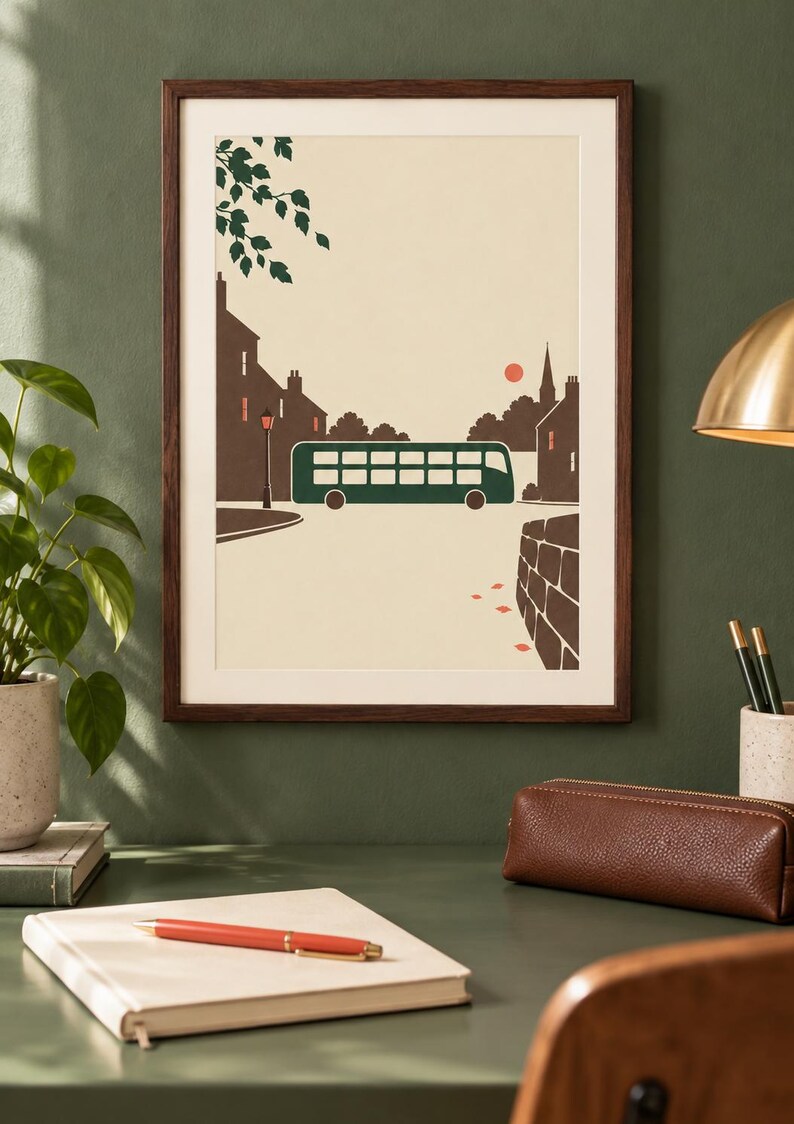 May include: A framed art print featuring a stylized illustration of a dark green double-decker bus driving through a town street. The scene includes brown silhouettes of buildings, a small red sun, a street lamp, and green tree leaves in the corner.