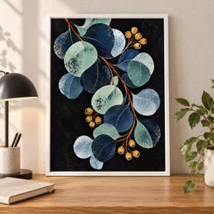 May include: A framed wall art print featuring a botanical illustration of eucalyptus branches with rounded leaves in shades of navy blue, teal, and light green, accented by small golden seed pods against a solid black background.