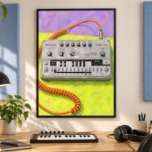 May include: A framed wall art print featuring a silver Roland TB-303 Bass Line synthesizer with a bright orange coiled cable. The device is set against a vibrant background of purple and lime green, showcasing its knobs, switches, and keys.