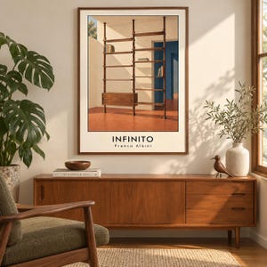 May include: A framed wall art print titled INFINITO by Franco Albini, depicting a floor-to-ceiling wooden shelving unit with a cabinet in a room with terracotta floors and blue walls, displayed in a wooden frame with a white mat border.