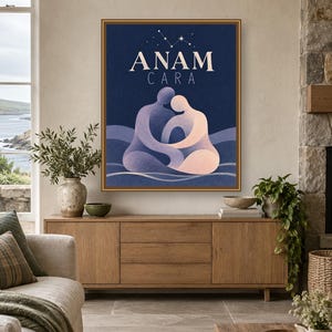 May include: A framed rectangular wall art print featuring a dark blue background with the text ANAM CARA in white. The illustration depicts two abstract figures in shades of purple and peach embracing, set against wavy lines with a star constellation above.