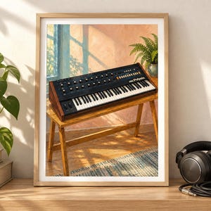 May include: A framed art print featuring a black Korg Poly-61 synthesiser with wooden side panels, resting on a wooden bench in a sunlit room. The keyboard has numerous knobs, switches, and white and black keys, displayed in a light wood frame.