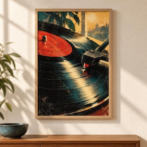 May include: A framed wall art print featuring a close-up illustration of a black vinyl record spinning on a turntable. The record has a vibrant red center label. A tonearm with a stylus rests on the grooves. The background shows a warm, golden sunset.