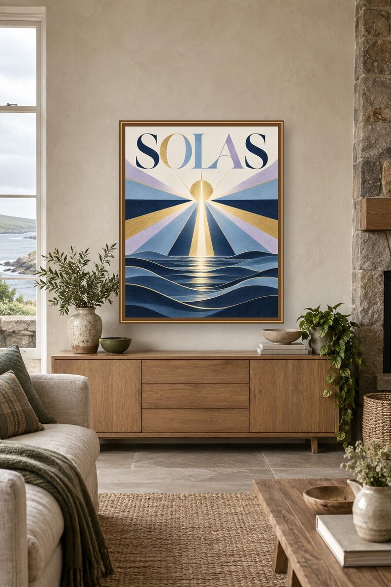 May include: A rectangular framed wall art print featuring the word SOLAS in large dark blue letters at the top. The artwork depicts a stylized sun rising over dark blue ocean waves with radiating beams of light in gold, blue, and lavender.