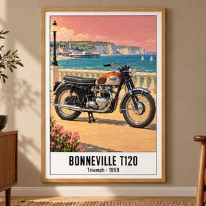 May include: A framed wall art print featuring a vintage orange and silver Triumph Bonneville T120 motorcycle parked on a seaside promenade. The text at the bottom reads BONNEVILLE T120 Triumph 1959. The background shows a coastal town and ocean.