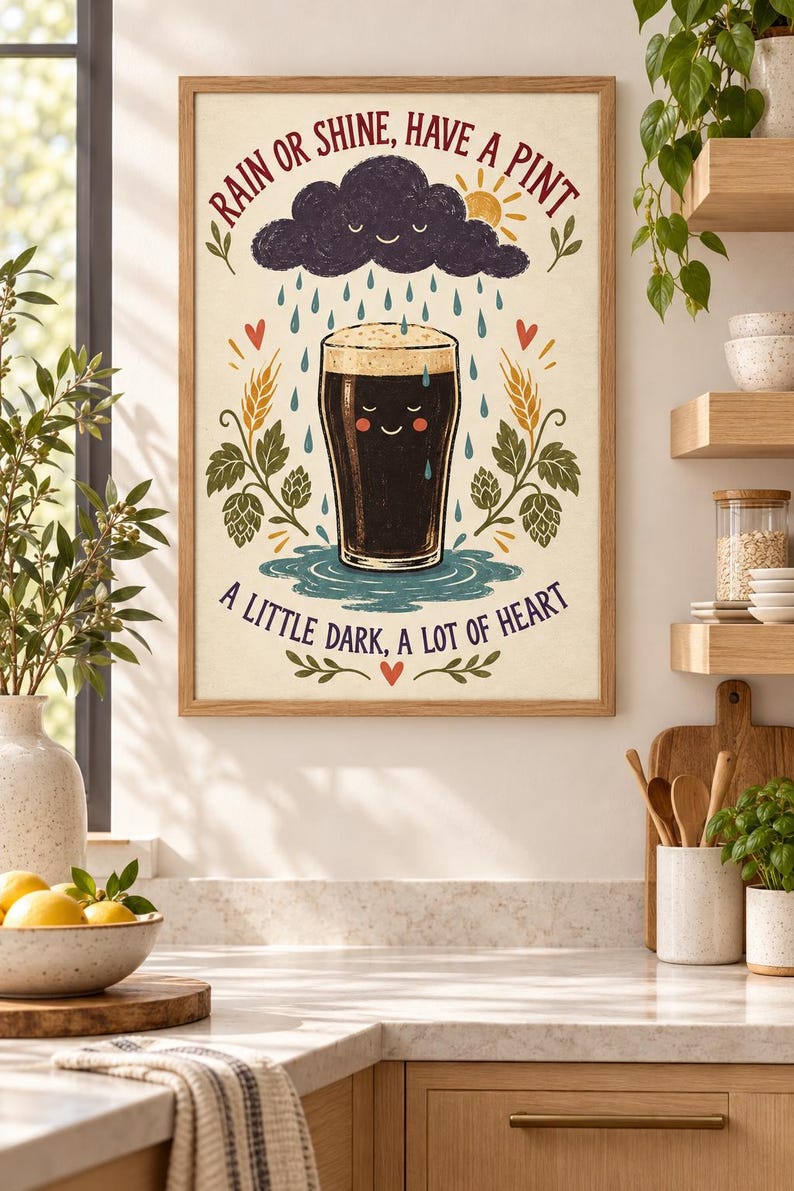 May include: A framed wall art print featuring a dark beer pint with a smiling face, surrounded by hops and wheat. Above is a smiling rain cloud and sun. The text reads: RAIN OR SHINE, HAVE A PINT and A LITTLE DARK, A LOT OF HEART in red and blue.