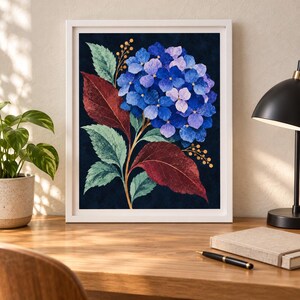 May include: A framed wall art print featuring a vibrant blue and purple hydrangea flower cluster with textured green and deep red leaves against a dark navy background. The artwork includes thin stems with small golden berries on each side.