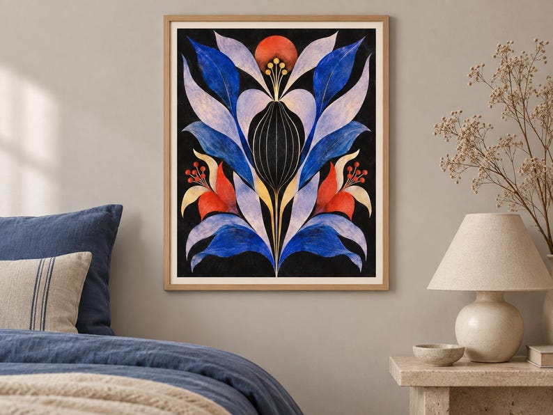 May include: A framed vertical wall art print featuring a symmetrical botanical illustration on a black background. The design displays stylised blue, light purple, and red leaves and flowers with thin gold lines and circular accents in a central motif.