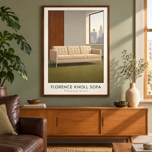 May include: A framed wall art print featuring a beige tufted sofa with a metal frame, set in a room with a window view of a city skyline. The text FLORENCE KNOLL SOFA and Florence Knoll is printed in black at the bottom of the white-bordered image.
