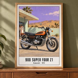 May include: A framed wall art print featuring a vintage orange and black Kawasaki 900 Super Four Z1 motorcycle parked at a gas station in a desert landscape. The text at the bottom reads 900 SUPER FOUR Z1 and Kawasaki 1972 in black font.