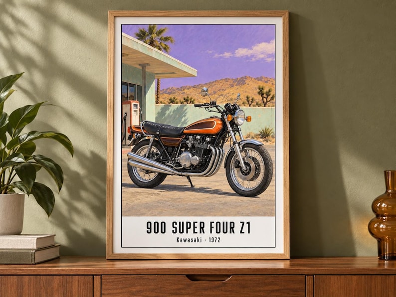 May include: A framed wall art print featuring a vintage orange and black Kawasaki 900 Super Four Z1 motorcycle parked at a gas station in a desert landscape. The text at the bottom reads 900 SUPER FOUR Z1 and Kawasaki 1972 in black font.