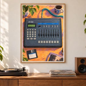 May include: A framed art print depicting a dark gray SP-1200 drum machine with a green digital display, multiple sliders, and buttons. A black floppy disk sits below the device on an orange surface, accompanied by a blue coiled cable and a mug.