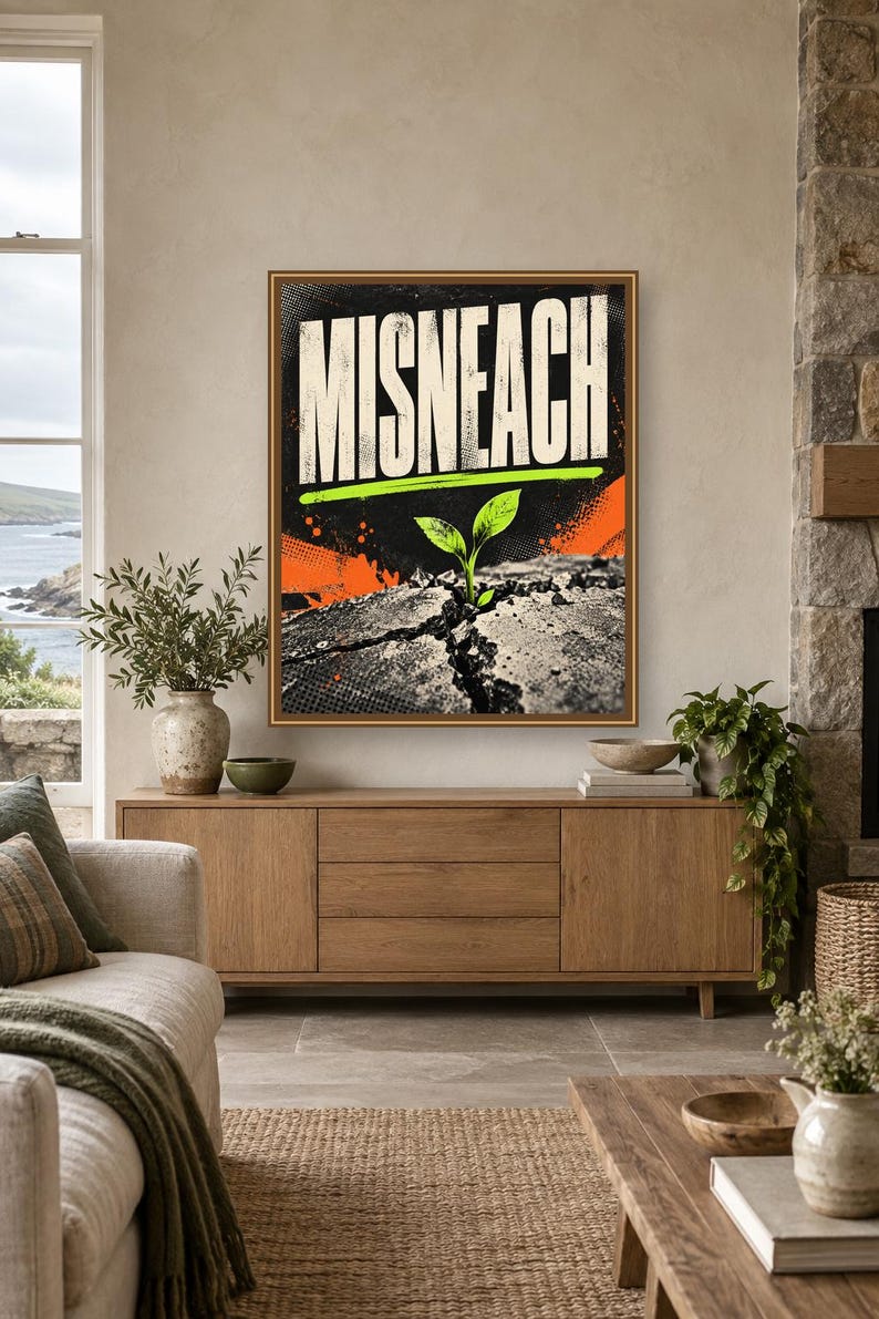 May include: A rectangular wall art print featuring the word MISNEACH in large white capital letters. Below the text, a small green sprout emerges from a cracked, textured gray surface. The background includes orange and black graphic accents.