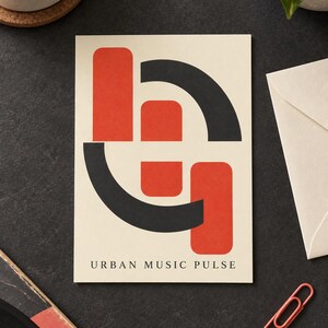May include: A rectangular card featuring a cream background with a bold graphic design of interlocking red and black geometric shapes. The text "URBAN MUSIC PULSE" is printed in a simple black sans-serif font at the bottom of the card.