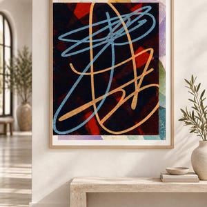 May include: A framed rectangular wall art piece featuring an abstract composition with a dark background, layered with bold red geometric shapes and prominent, sweeping light blue and golden-yellow linear strokes that create a dynamic visual effect.