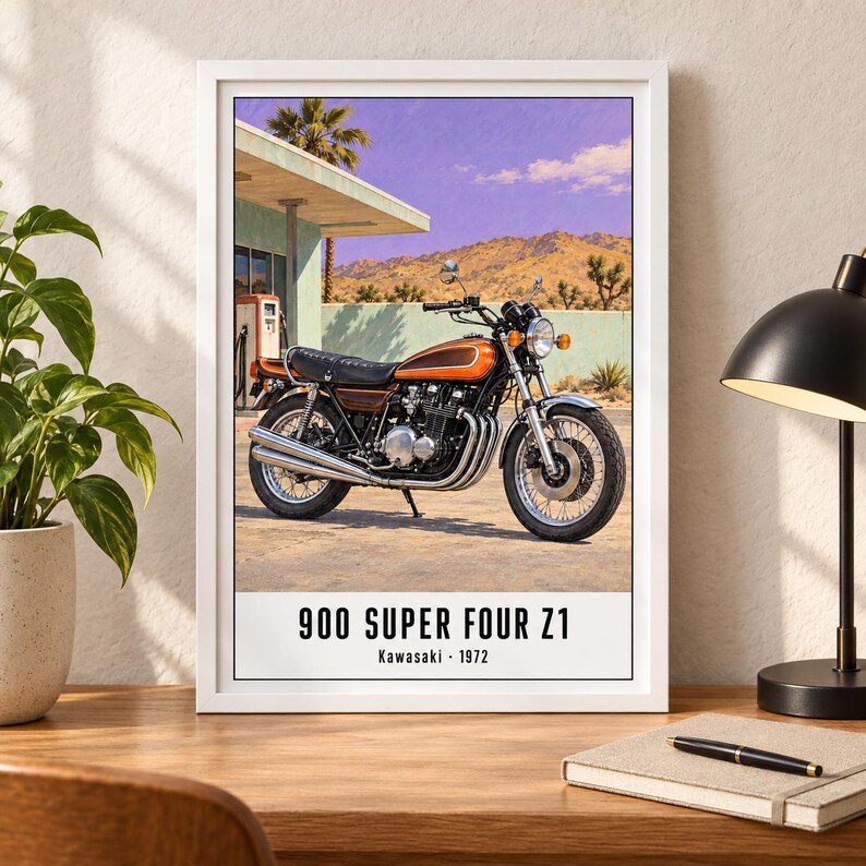 May include: A framed wall art print featuring a 1972 Kawasaki 900 Super Four Z1 motorcycle parked at a desert gas station. The motorcycle is orange and black with chrome exhaust pipes. The text at the bottom reads 900 SUPER FOUR Z1 Kawasaki 1972.