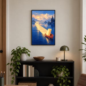 Op de afbeelding: Een ingelijste kunstdruk met een rode roeiboot op een diepblauw meer bij zonsondergang. Een grote rol keukenpapier staat in de boot, verlicht door een helder gouden lichtpad dat op het water reflecteert richting de besneeuwde bergtoppen.