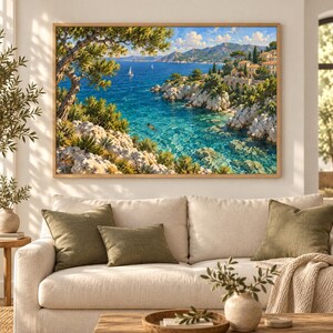 May include: A rectangular wall art print featuring a coastal landscape with rocky cliffs, lush green trees, and a clear blue sea. A small sailboat floats on the water near a distant mountain range, while a person swims in the turquoise cove.
