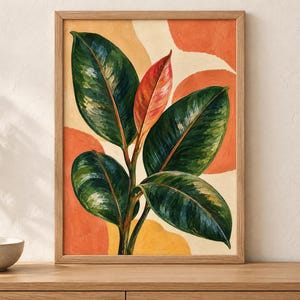 May include: A framed wall art print featuring a rubber plant with large, glossy dark green leaves and a single central reddish-orange leaf. The background consists of abstract, rounded shapes in shades of cream, yellow, and burnt orange.