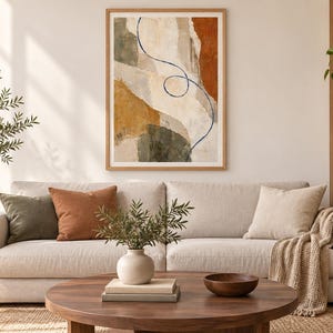 Puede incluir: Una impresi&oacute;n de arte mural abstracto enmarcada con formas superpuestas en tonos verde oliva, naranja quemado y crema, acentuada por una fina l&iacute;nea continua de color azul oscuro que se curva verticalmente por la composici&oacute;n.