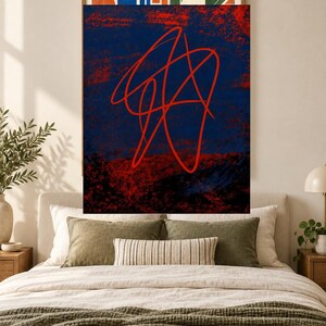 May include: A rectangular wall art print featuring a dark navy blue background with a textured, distressed red overlay. A continuous, fluid red line forms an abstract, tangled scribble pattern across the center of the composition.